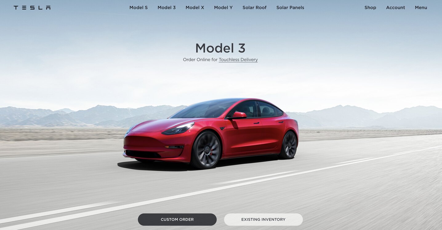 The image of Tesla's Model 3 in red, featured on the company website's home page