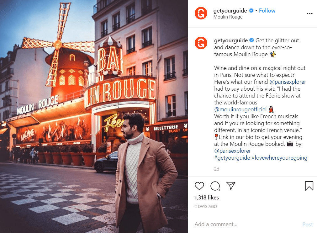 Instagram post by GetYourGuide, showing a man standing outside Moulin Rouge in Paris