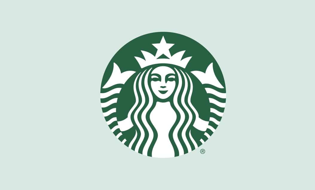 A green and white Starbucks logo picturing a smiling woman with long wavy hair and a crown