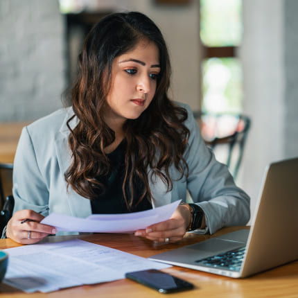 A woman following the business growth consulting strategy recommendation of identifying revenue streams
