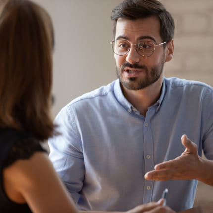 A New York software development company client discussing project scope and requirements with an expert