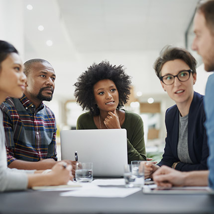 a group of people discussing design ideas