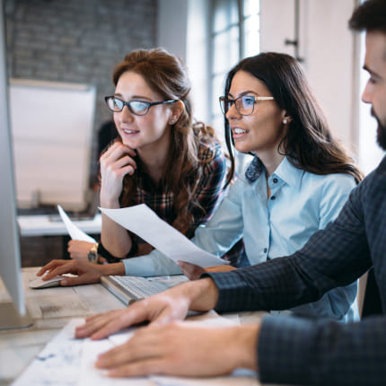 Team research together on a computer