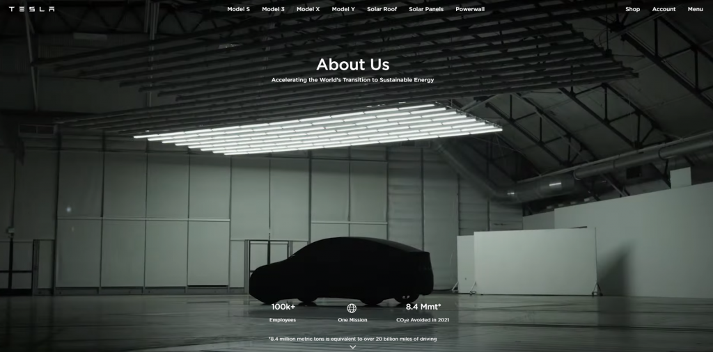 Tesla's home page featured image of a Tesla auto covered with a piece of fabric.