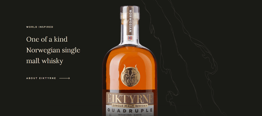 Eiktyrne's website homepage, featuring a bottle of whiskey on a black background