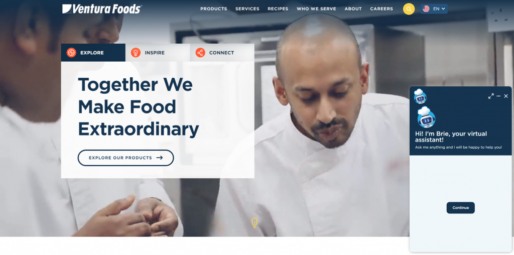 A Ventura Foods' landing page with the chatbot in the bottom right corner.