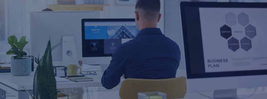 Background image of a designer on a computer