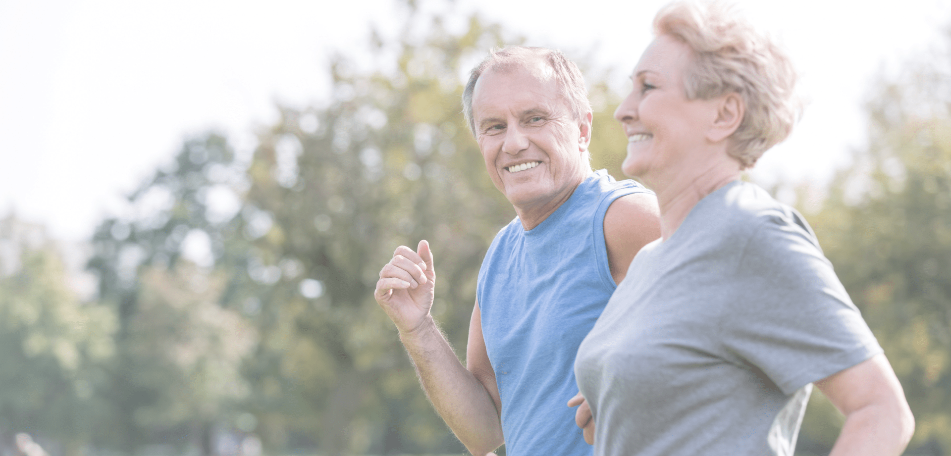 Two joggers smiling at eachother