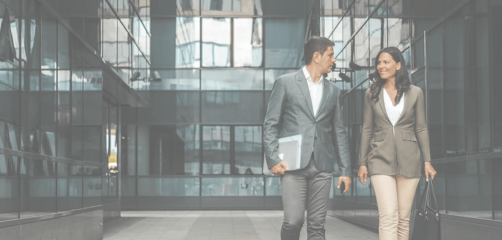 A couple walk together in smart dress