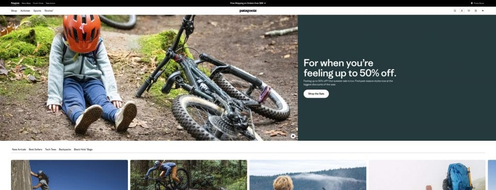 Patagonia's homepage that contains an image of a child wearing a head helmet, sitting on the ground with a bike placed next to it.