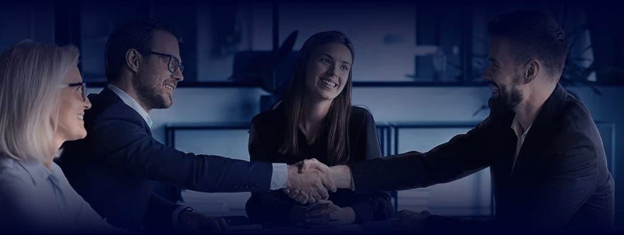 Background image for Procom's case study, showing a group of people shaking hands