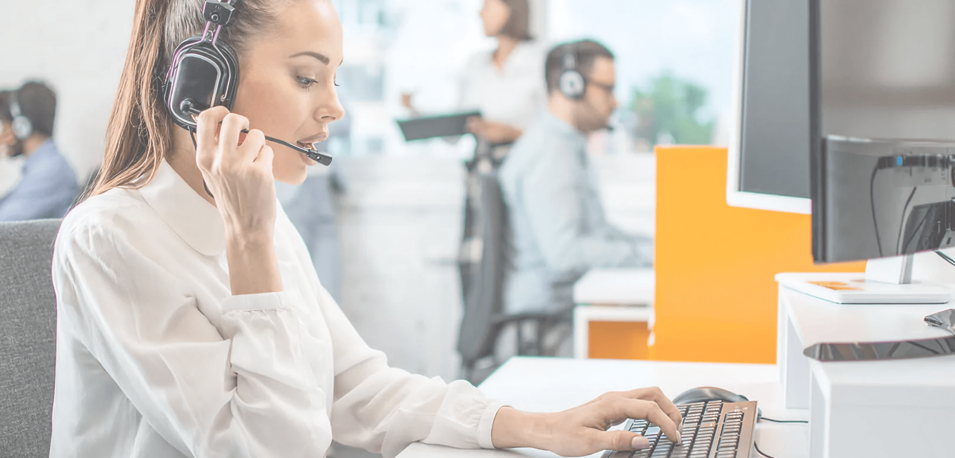 Background image for Servion's case study showing a woman in customer service