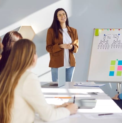 SEO strategist presenting campaign ideas and planning notes to a team in a meeting room