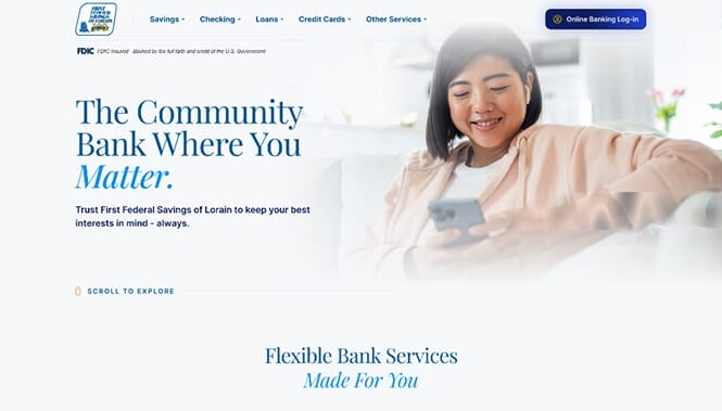 Finance & Banking Web Design 58 Banking website hero featuring a smiling woman using her phone with messaging about community-focused banking services.