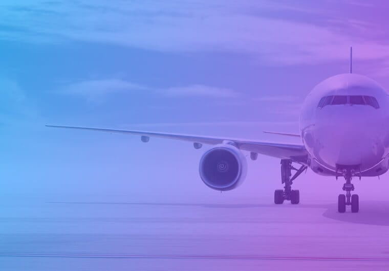 Front view of a commercial airplane on a runway