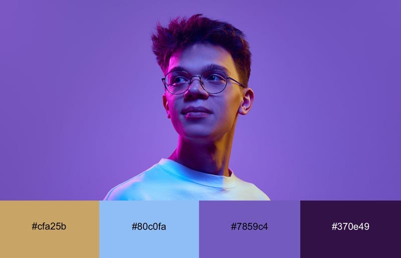 These Are The 20 Best Neon Color Palettes For Impressive Designs 4 A guy with neon purple and orange light cast over him