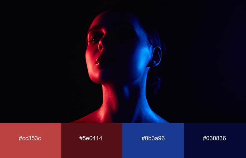 These Are The 20 Best Neon Color Palettes For Impressive Designs 13 A woman with neon red and blue light cast over her