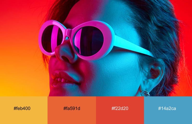These Are The 20 Best Neon Color Palettes For Impressive Designs 5 A girl with glasses bathed in neon red, yellow and blue light