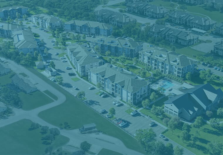 Aerial view of a large residential apartment community with multiple buildings