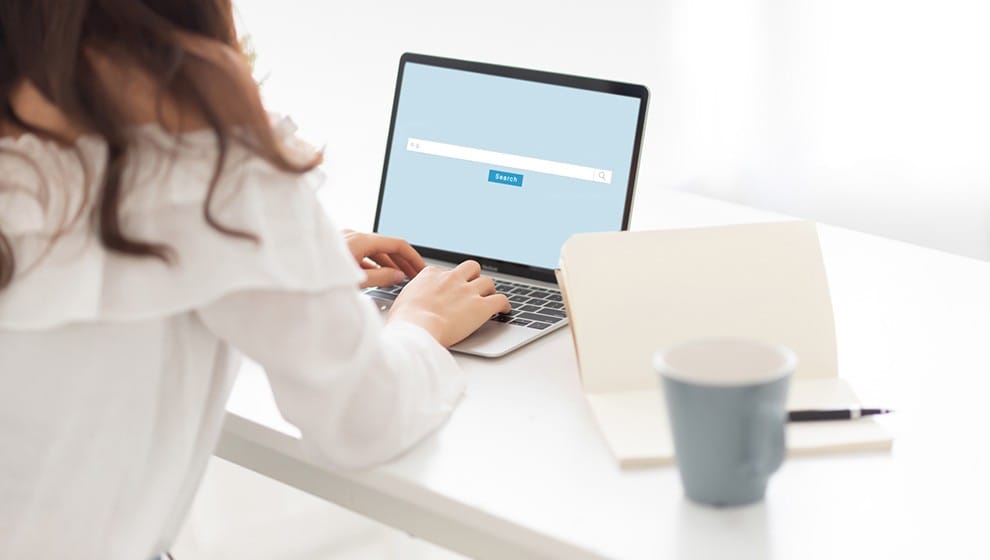 Custom Intent Audiences: How To Target More Prospects With Your Campaigns 2 A woman types at her laptop, indicating her user search intent